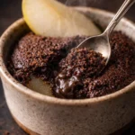 Close up of fork cutting into fudgy 3 ingredient chocolate pear cake showing moist interior"