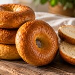 Carnivore Bagels (Chewy, Fluffy & Easy 3-Ingredient Recipe) 19 Freshly baked carnivore bagels with a golden crust and chewy texture on a wooden board.